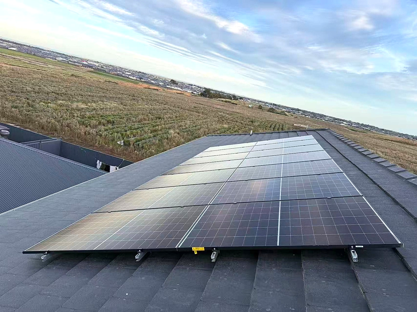 10kW commercial solar panel array on metal roof